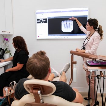 Bespoke Dentistry - Dr. Leah explaining x-rays during exam - Cosmetic Dentists Near Me - San Diego, California Bespoke Dentistry - Dr. Leah explaining x-rays during exam - Cosmetic Dentists Near Me - San Diego, California