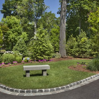 Kindergan Landscaping - a park bench in the middle of a garden - Landscaping Near Me - Bergenfield, New Jersey Kindergan Landscaping - a park bench in the middle of a garden - Landscaping Near Me - Bergenfield, New Jersey