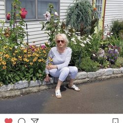 Nature's Cupboard - Owner, Anne, tending to the store's garden