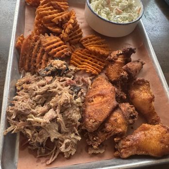 Poogan's Smokehouse - Pulled pork, smoked chicken wings, coleslaw and sweet potato fries. Not shown, the empanadas. - Southern Near Me - Charleston, South Carolina Poogan's Smokehouse - Pulled pork, smoked chicken wings, coleslaw and sweet potato fries. Not shown, the empanadas. - Southern Near Me - Charleston, South Carolina