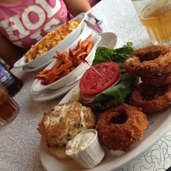 Howley's Restaurant - Jumbo Lump Crabcake sandwich with onion rings and custom Mac & Cheese with bacon and crabmeat. Awesome! - Diners Near Me - West Palm Beach, Florida