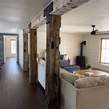 Superior Tile and Stone - Home remodel including reclaimed barn posts and beam, bamboo floor, shiplap walls, barn wood wall, and wood stove - Tiling Near Me Superior Tile and Stone - Home remodel including reclaimed barn posts and beam, bamboo floor, shiplap walls, barn wood wall, and wood stove - Tiling Near Me