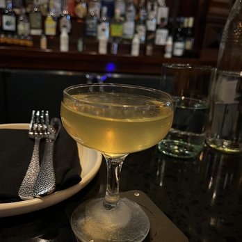 Post Haste - a glass of wine and a plate of silverware - Cocktail Bars Near Me - Philadelphia, Pennsylvania