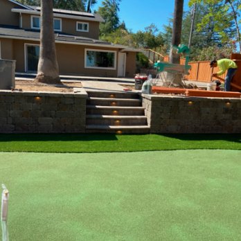 East Bay Pavers - a man putting a putt on a putting green - Landscaping Near Me East Bay Pavers - a man putting a putt on a putting green - Landscaping Near Me