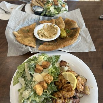 Taziki's Mediterranean Cafe - Shrimp Caesar salad, hummus with crunch pita chips, & chicken Caesar with potatoes - Salad Near Me - Johns Creek, Georgia Taziki's Mediterranean Cafe - Shrimp Caesar salad, hummus with crunch pita chips, & chicken Caesar with potatoes - Salad Near Me - Johns Creek, Georgia