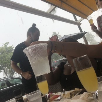 Palace Bar - Pouring rain through the holes of the awning - Gay Bars Near Me - Miami Beach, Florida