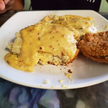 Biscuit Head - Biscuit and cheddar & bacon gravy with the fried green tomato from my biscuit. - Cafes Near Me - Asheville, North Carolina