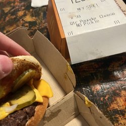 McDonald's - my no pickle sandwich with pickles. I ordered two of them. Both of them had three pickles each.