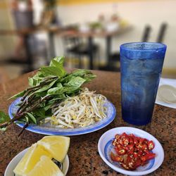 Thuong An Lac - Condiments for pho and a glass of iced barley tea