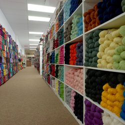 The Loopy Ewe - Aisles full of beautiful yarn choices, from laceweight to bulky.