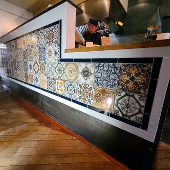 Unity Tile and Design - a kitchen counter with a counter top - Tiling Near Me - Asheville, North Carolina Unity Tile and Design - a kitchen counter with a counter top - Tiling Near Me - Asheville, North Carolina