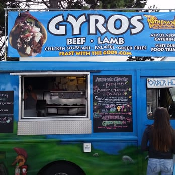 Athena's - a group of people standing in front of a food truck - Greek Near Me - Seattle, Washington Athena's - a group of people standing in front of a food truck - Greek Near Me - Seattle, Washington