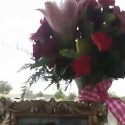 Bright flower arrangement for celebration of life ceremony. Bright flower arrangement for celebration of life ceremony.
