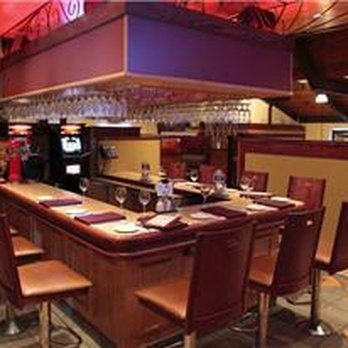 Le Grand Bourg - a restaurant with a bar and chairs - Seafood Near Me - Quebec City, Quebec Le Grand Bourg - a restaurant with a bar and chairs - Seafood Near Me - Quebec City, Quebec