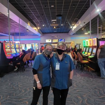 Grand Lake Casino - two people standing in front of slot machines - Casinos Near Me - Grove, Oklahoma Grand Lake Casino - two people standing in front of slot machines - Casinos Near Me - Grove, Oklahoma
