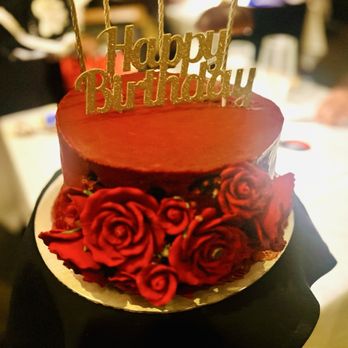 Sweet Red Peach - Dark Chocolate cake w/ white frosting between layers. Red buttercream frosting, red roses w/ metallic gold stamen. - Desserts Near Me - Atlanta, Georgia Sweet Red Peach - Dark Chocolate cake w/ white frosting between layers. Red buttercream frosting, red roses w/ metallic gold stamen. - Desserts Near Me - Atlanta, Georgia