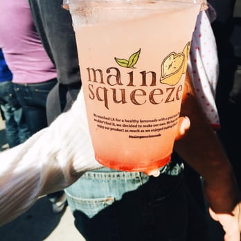 Main Squeeze Lemonade - a person holding a drink - Food Trucks Near Me Main Squeeze Lemonade - a person holding a drink - Food Trucks Near Me