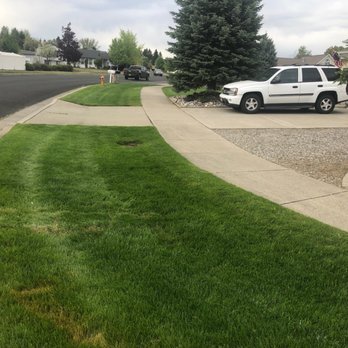 Liberty Lawn - a white suv parked on the side of the road - Lawn Services Near Me Liberty Lawn - a white suv parked on the side of the road - Lawn Services Near Me