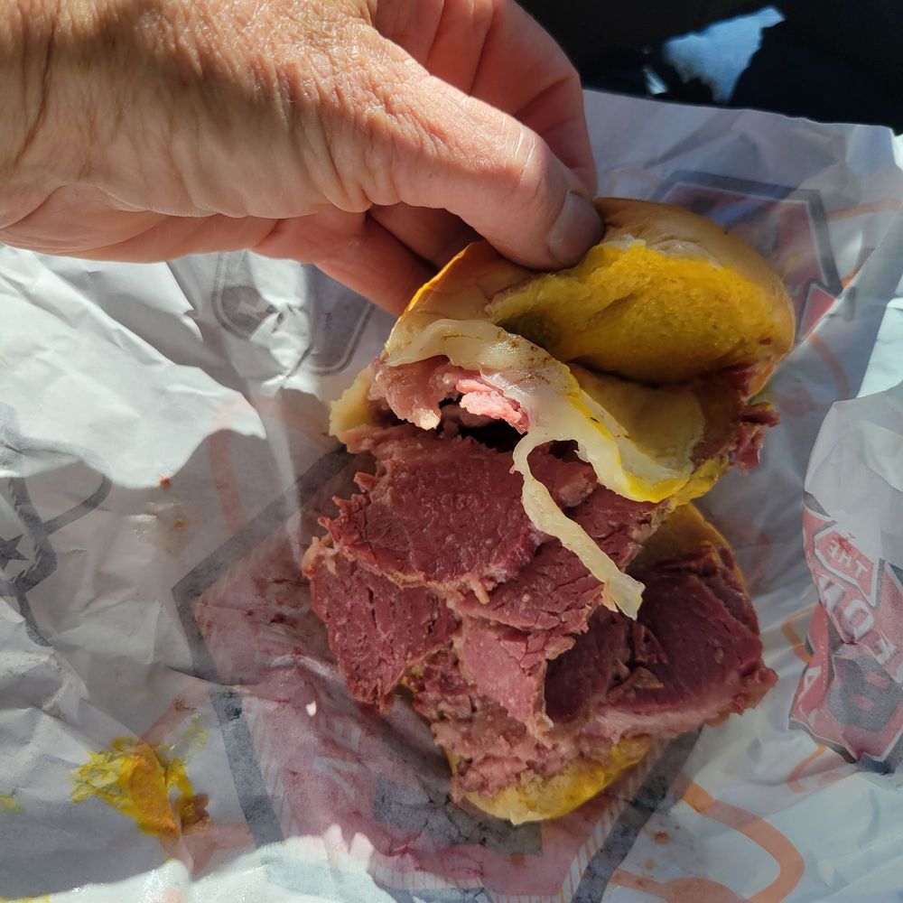 Corned beef with provolone and yellow mustard on a Martin's potato bun. Corned beef with provolone and yellow mustard on a Martin's potato bun.