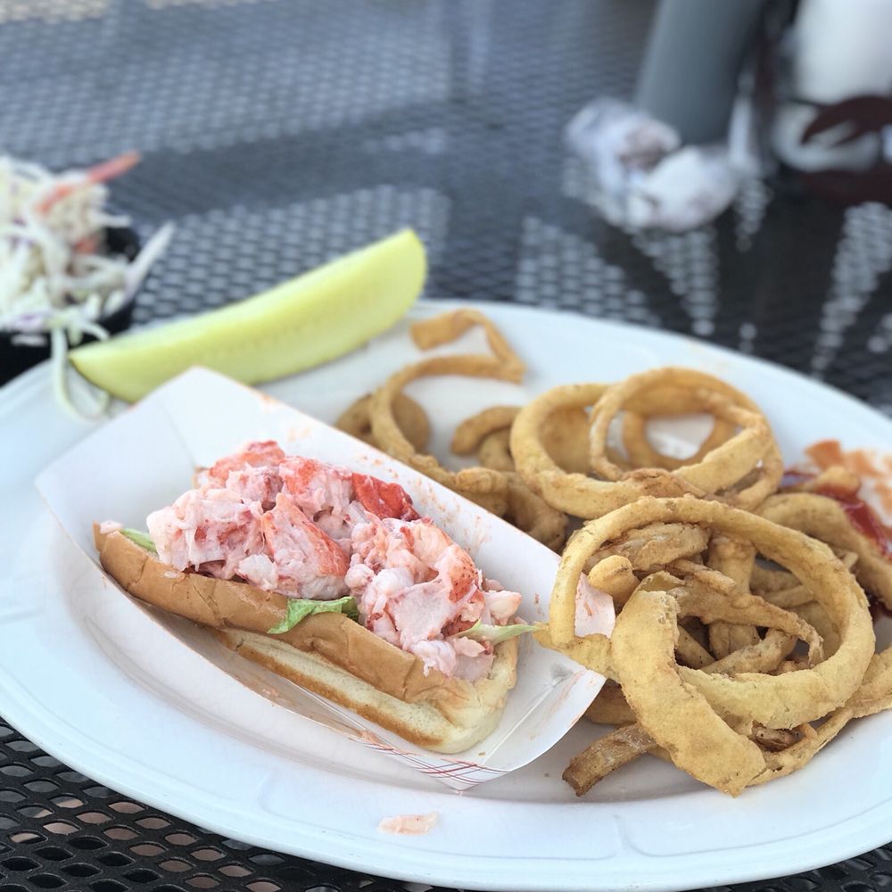 Dockside Family Restaurant - Lobster roll, onion rings, cole slaw and a pickle. It's was ok for having a lobster roll craving, not sure it was worth the $21 - Seafood Near Me - Belfast, Maine