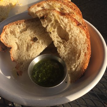Salt and Iron - House bread with chimmichuri sauce. - Seafood Near Me - Edmonds, Washington Salt and Iron - House bread with chimmichuri sauce. - Seafood Near Me - Edmonds, Washington