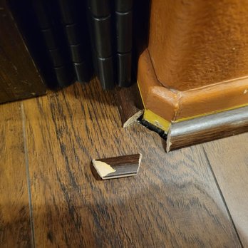 Empire Today - a broken wallet on the floor - Flooring Near Me