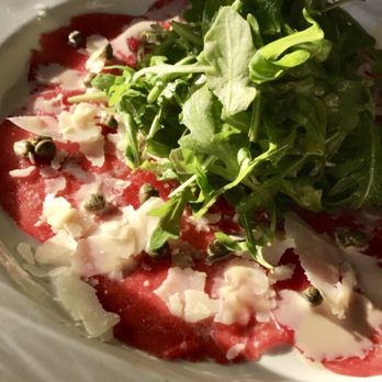 Mi Piace - Thinly sliced Filet Mignon topped with capers and arugula. - Italian Near Me - Pasadena, California