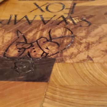 The Swamp Fox Restaurant - Swamp Fox Restaurant logo on wood block tray charcuterie - Southern Near Me - Charleston, South Carolina The Swamp Fox Restaurant - Swamp Fox Restaurant logo on wood block tray charcuterie - Southern Near Me - Charleston, South Carolina
