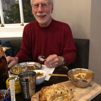 Soho Wala - The Kali dal with choor choor naan is in the foreground. - Indian Near Me - London, XGL Soho Wala - The Kali dal with choor choor naan is in the foreground. - Indian Near Me - London, XGL