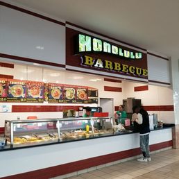 a man standing in front of the counter a man standing in front of the counter