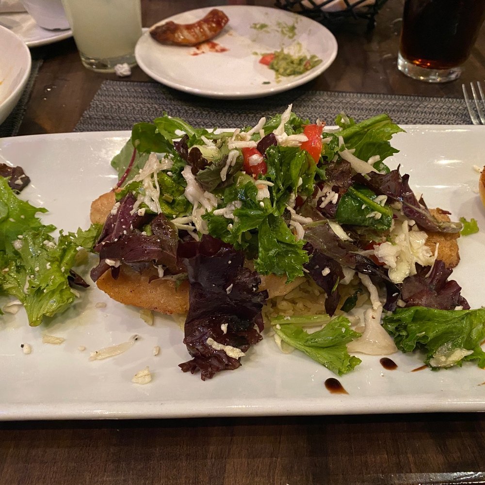 Luna Modern Mexican Kitchen - There is actually a thin piece of roughy fish in between the greens and rice. - Mexican Near Me - Corona, California