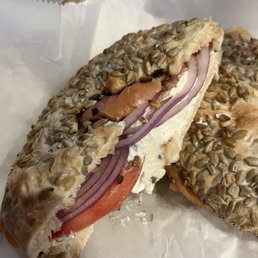 a bagel sandwich on a wrapper a bagel sandwich on a wrapper