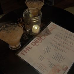 The Den - Menu and table with drinks!