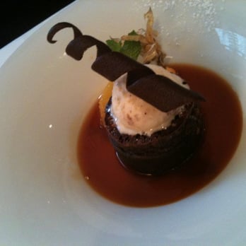 Le Crocodile Restaurant - Warm soft chocolate cake with an orange reduction & nougatine ice cream - French Near Me - Vancouver, British Columbia Le Crocodile Restaurant - Warm soft chocolate cake with an orange reduction & nougatine ice cream - French Near Me - Vancouver, British Columbia
