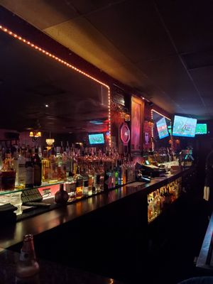 Photo of The Fling - Santa Ana, CA, US. a bar with a lot of bottles of alcohol