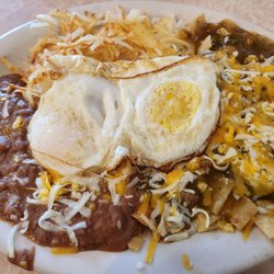 Mary's Restaurant - Chilequiles with hash browns. Over easy eggs and pork green chile.