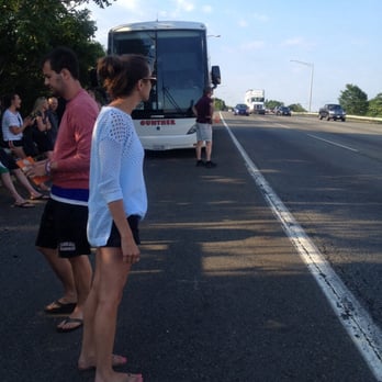 Tripper Bus - Sunday, June 29, 2014. Passengers of the 5:00pm broken down Tripper Bus on the NJ Turnpike attempting to defy death/hitch rides. - Buses Near Me - Bethesda, Maryland