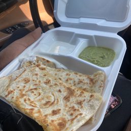 Cheese quesadilla. Comes with sour cream, guacamole and a little side of pico de Gallo.