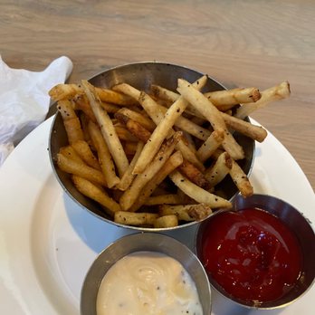 Earls Kitchen + Bar - This is truffle fries...looks like it came from the freezer to the plate with salt and pepper on it ...seriously this it $20.00 - Canadian (New) Near Me - Whistler, British Columbia