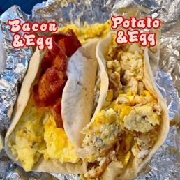 One egg and bacon taco, one egg and potato taco- both on flour tortillas.