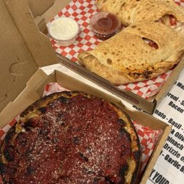 Pep and sausage personal Chicago-style deep dish & The Hawaiian personal calzone. Pep and sausage personal Chicago-style deep dish & The Hawaiian personal calzone.