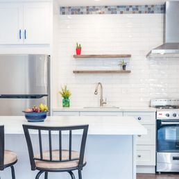 a modern kitchen with stainless steel appliances