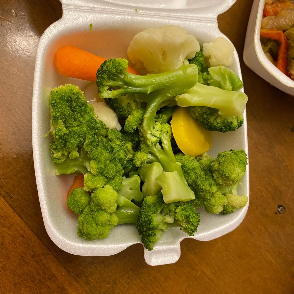 broccoli and carrots in a styrofoam container broccoli and carrots in a styrofoam container