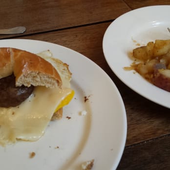 The Black Cat Cafe - The bagel breakfast sandwich with a side of home fries. - Breakfast & Brunch Near Me - Devon, Pennsylvania