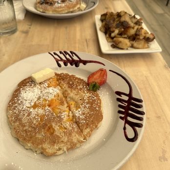 Naked Cafe - Mango coconut pancake, rosemary potatoes, blueberry pancakes - Breakfast & Brunch Near Me - Solana Beach, California Naked Cafe - Mango coconut pancake, rosemary potatoes, blueberry pancakes - Breakfast & Brunch Near Me - Solana Beach, California