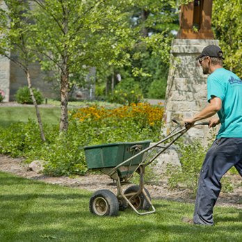 Landscape Associates - a man mowing the lawn - Landscaping Near Me - De Pere, Wisconsin Landscape Associates - a man mowing the lawn - Landscaping Near Me - De Pere, Wisconsin