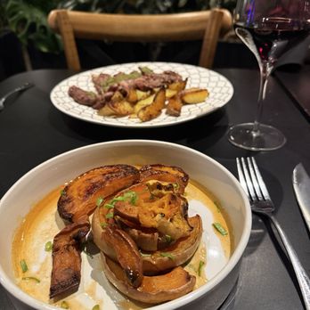 Raven - Pumpkin + squash seasonal offering (front) Ribeye + potatoes (back) - American Near Me - Oklahoma City, Oklahoma Raven - Pumpkin + squash seasonal offering (front) Ribeye + potatoes (back) - American Near Me - Oklahoma City, Oklahoma