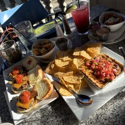 Micro burger, happy tots, garlic cheese curds, queso bean dip