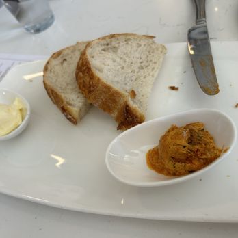 Taste on Main - Bread with paprika butter and butter. We already ate a couple slices. - Seafood Near Me - Buda, Texas Taste on Main - Bread with paprika butter and butter. We already ate a couple slices. - Seafood Near Me - Buda, Texas