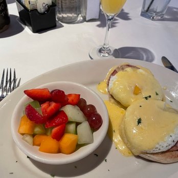 Weidmann's Restaurant - Eggs Benedict with fruit and mimosa - Steakhouses Near Me - Meridian, Mississippi Weidmann's Restaurant - Eggs Benedict with fruit and mimosa - Steakhouses Near Me - Meridian, Mississippi
